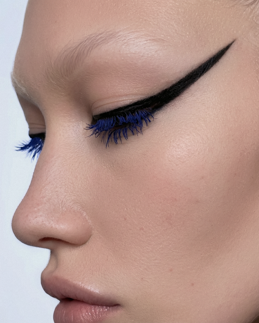 Profile with blue eyeliner